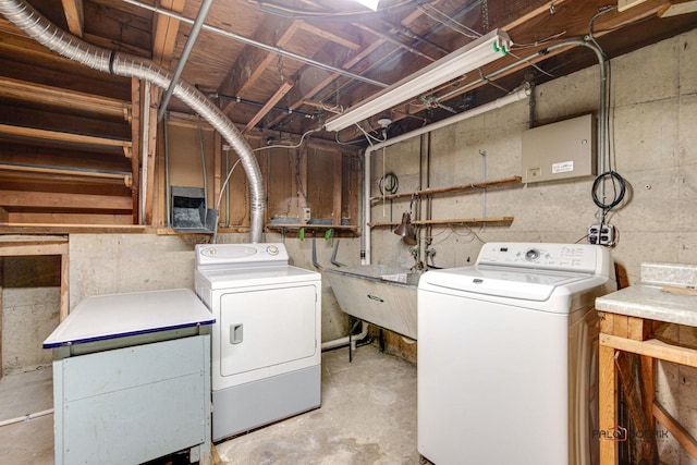 laundry area with sink and washing machine and clothes dryer