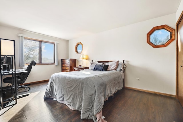 bedroom featuring dark hardwood / wood-style flooring