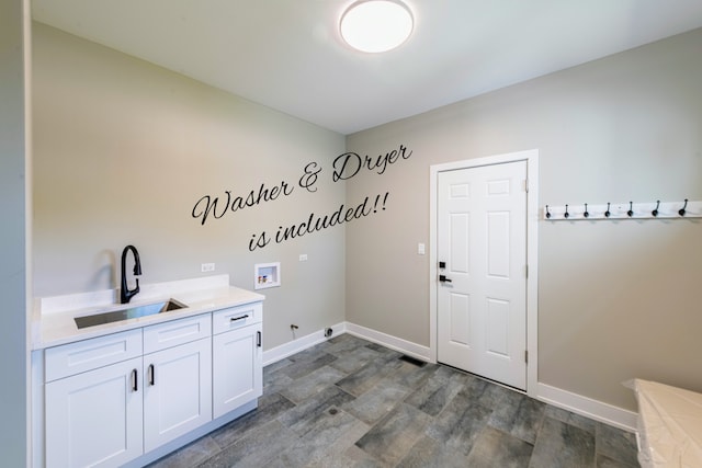 clothes washing area with sink, cabinets, washer hookup, dark hardwood / wood-style floors, and gas dryer hookup