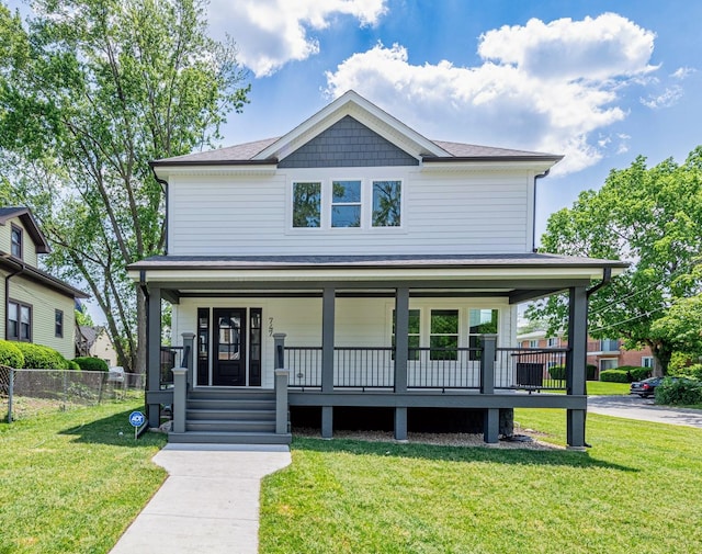 view of front facade featuring a porch and a front yard