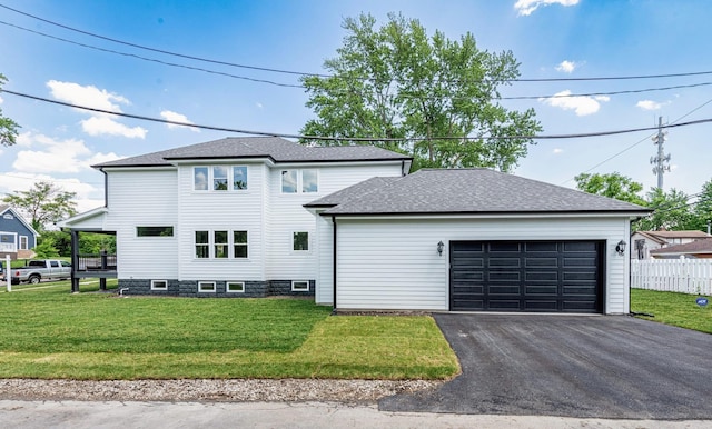 view of front facade featuring a front yard and a garage