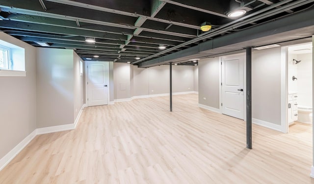 basement featuring light hardwood / wood-style floors