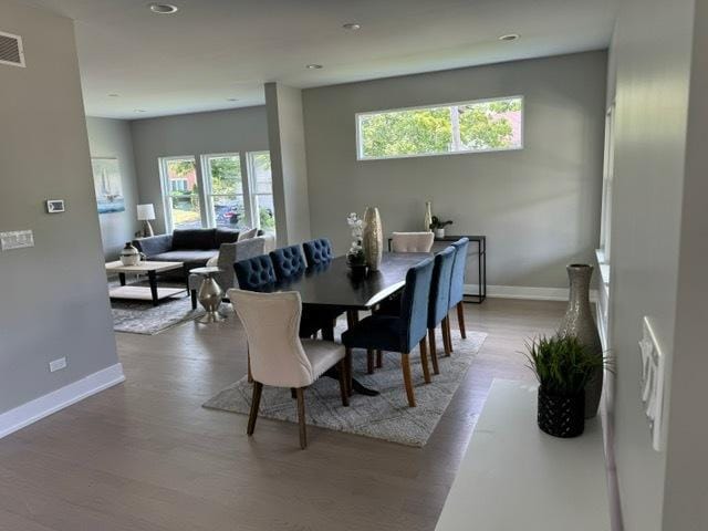 dining space with light hardwood / wood-style floors