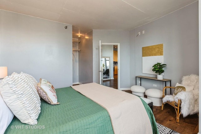 bedroom with hardwood / wood-style floors