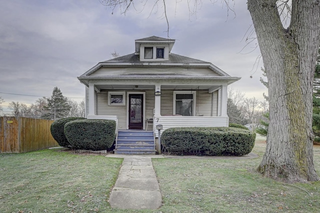 bungalow-style house with a front lawn