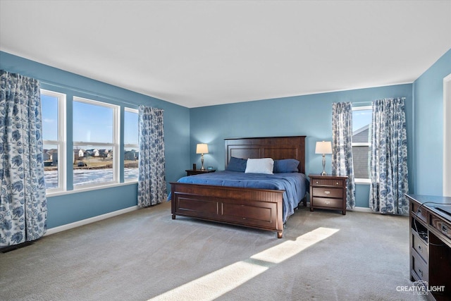 bedroom featuring light colored carpet