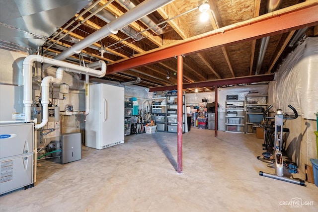 basement featuring white fridge