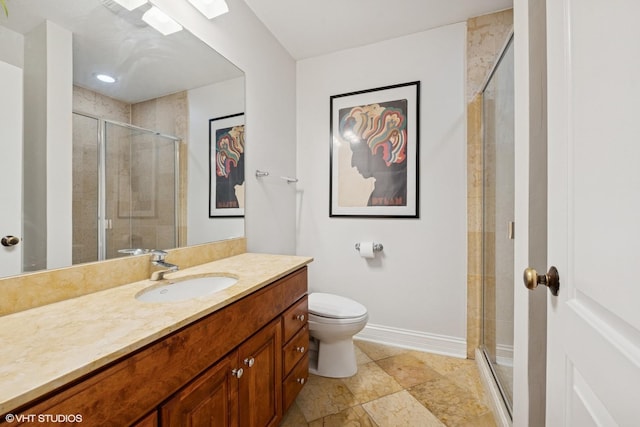 full bathroom featuring baseboards, toilet, a shower stall, and vanity