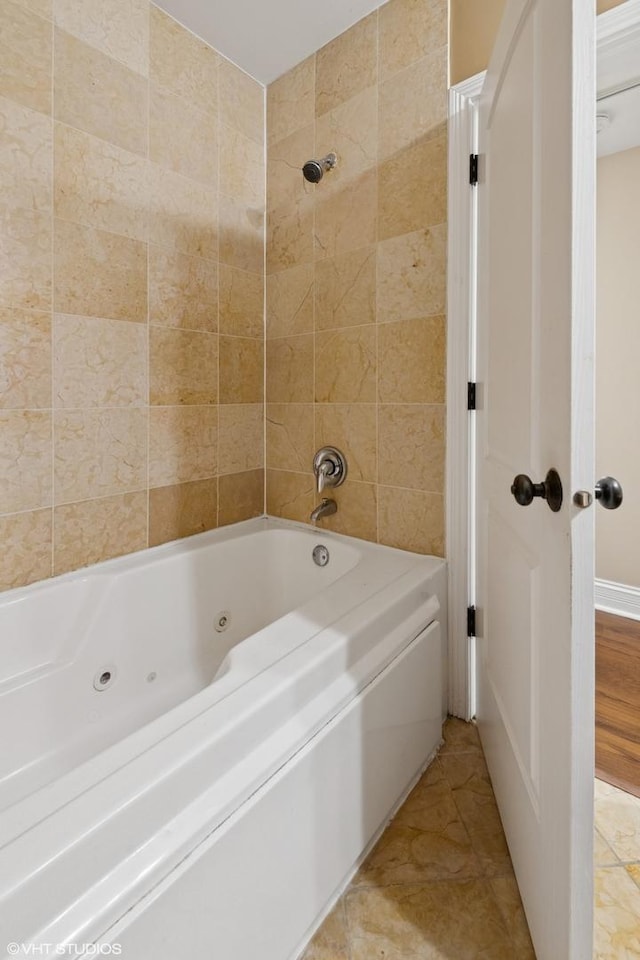 full bathroom featuring a combined bath / shower with jetted tub and tile patterned floors