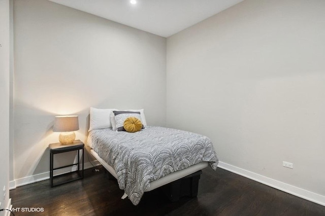 bedroom featuring dark wood-type flooring