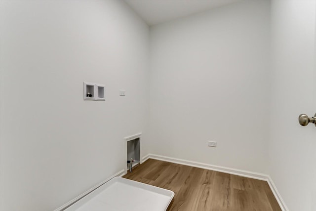 clothes washing area featuring washer hookup and wood-type flooring