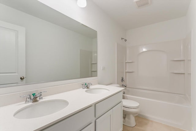 full bathroom featuring tile patterned floors, vanity, toilet, and shower / washtub combination