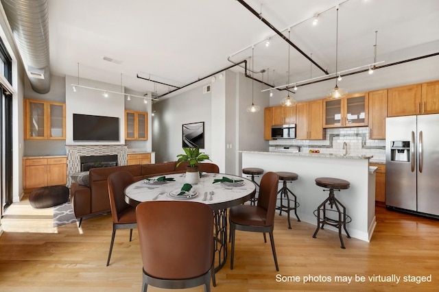 dining area featuring light hardwood / wood-style floors and sink