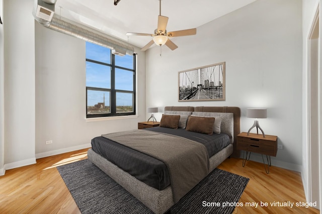 bedroom featuring wood-type flooring and ceiling fan