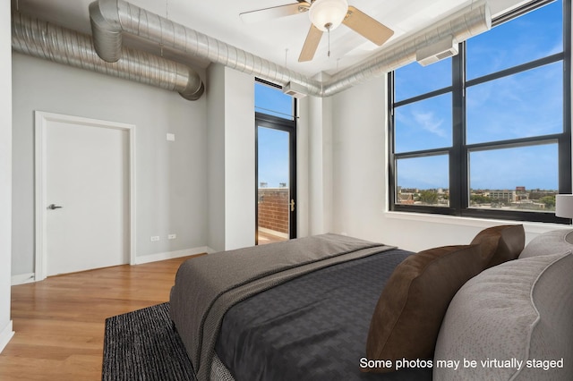 bedroom with light wood-type flooring and ceiling fan