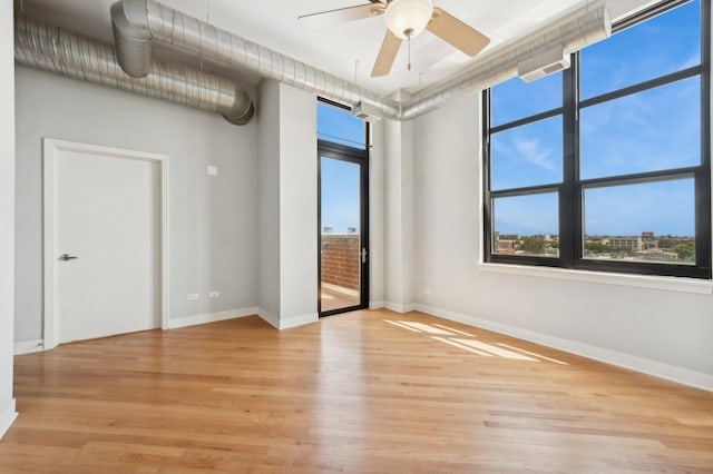 unfurnished room featuring ceiling fan and light hardwood / wood-style floors