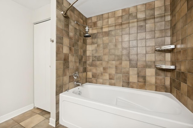 bathroom featuring tile patterned floors and tiled shower / bath