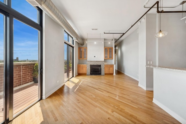 unfurnished living room featuring light hardwood / wood-style flooring