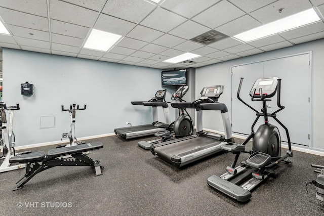 workout area featuring a drop ceiling