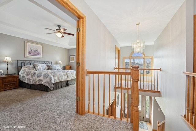 carpeted bedroom featuring a chandelier