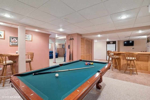 rec room with a dry bar, carpet floors, a paneled ceiling, and pool table