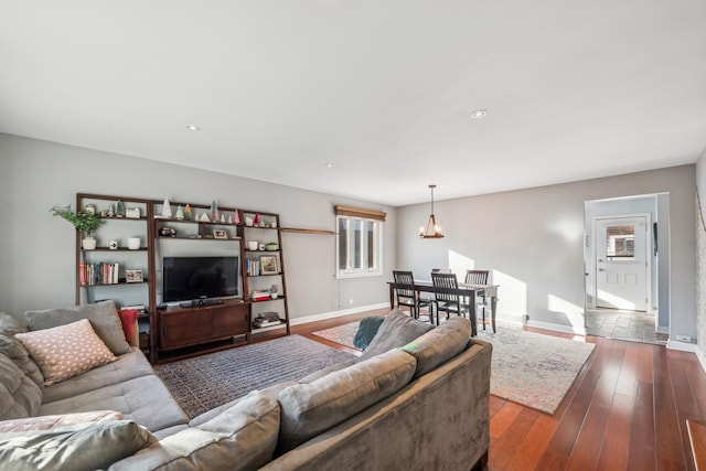 living room with dark hardwood / wood-style flooring