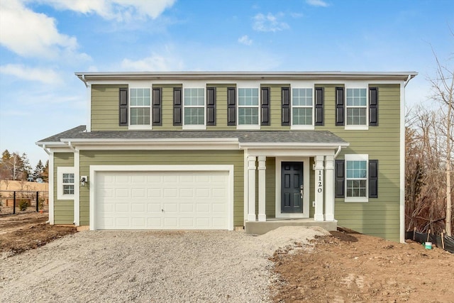 view of front of property featuring a garage