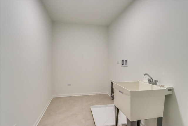 laundry room featuring light colored carpet, sink, and hookup for a washing machine