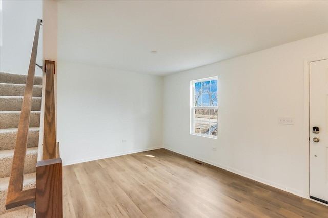 unfurnished room with light hardwood / wood-style floors