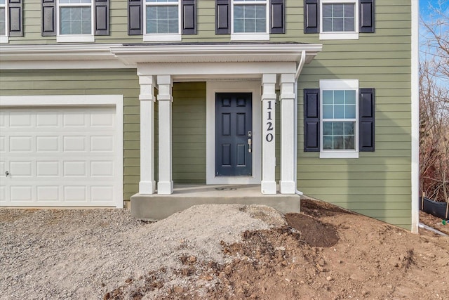 property entrance with a garage