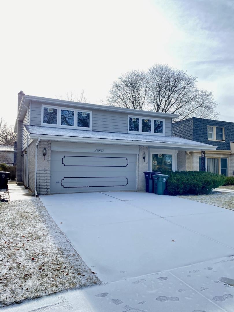 front of property with a garage