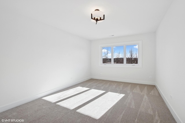 unfurnished room with light colored carpet