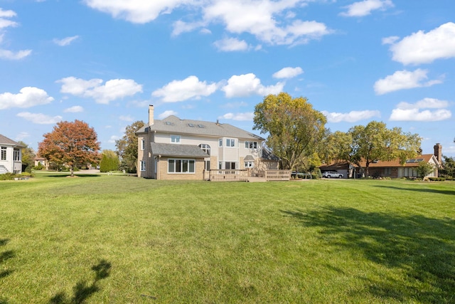 back of property featuring a lawn