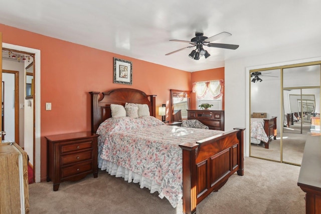 carpeted bedroom with a closet and ceiling fan