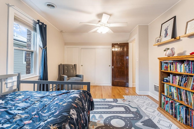 bedroom featuring a closet, ceiling fan, and light hardwood / wood-style flooring