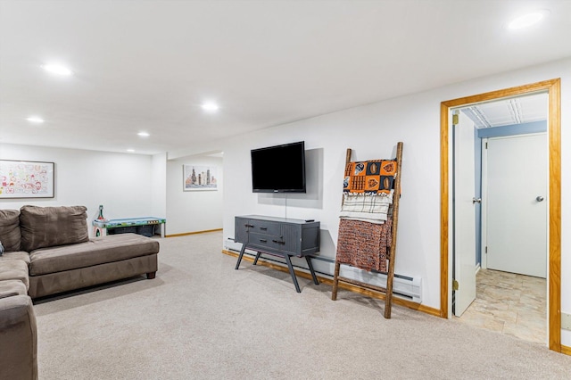 living room with a baseboard radiator and light colored carpet