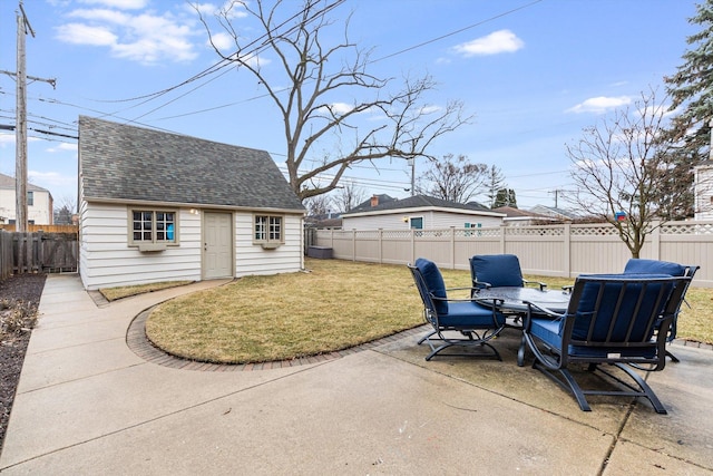 view of patio with an outbuilding