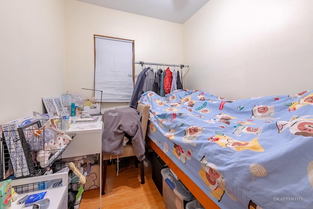 bedroom featuring hardwood / wood-style floors