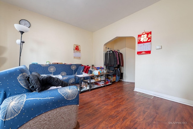 living room with dark wood-type flooring