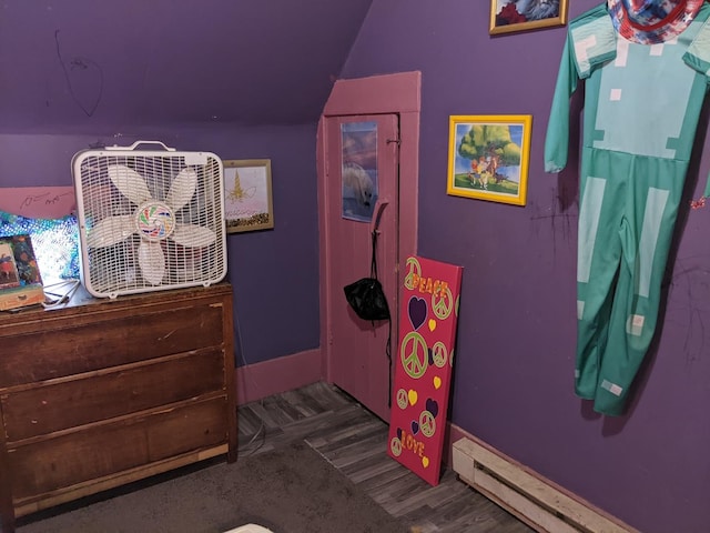 bedroom featuring dark hardwood / wood-style flooring and a baseboard radiator