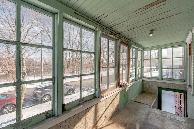 unfurnished sunroom with a wealth of natural light