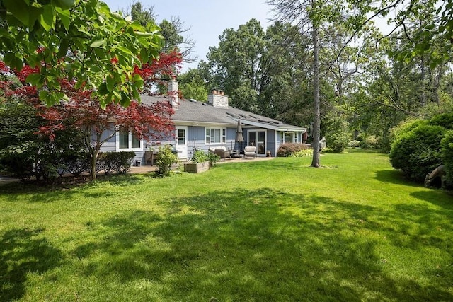 view of yard with outdoor lounge area and a patio