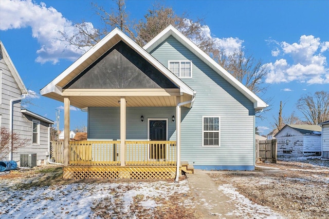 view of front of property with cooling unit and covered porch