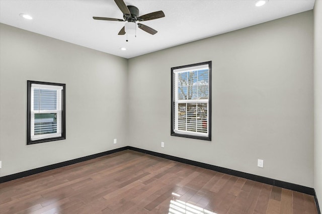 spare room featuring ceiling fan and wood-type flooring