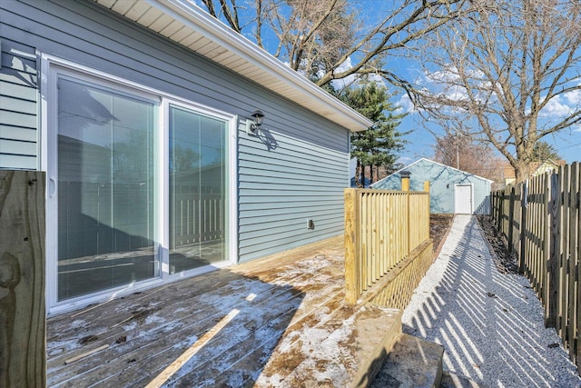 wooden deck featuring a shed