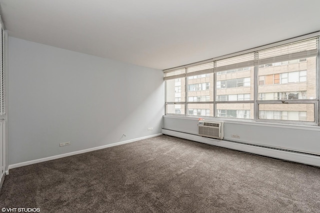 carpeted spare room featuring a wall unit AC and a baseboard heating unit