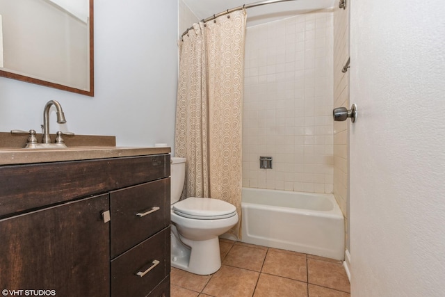 full bathroom featuring tile patterned flooring, vanity, shower / tub combo with curtain, and toilet