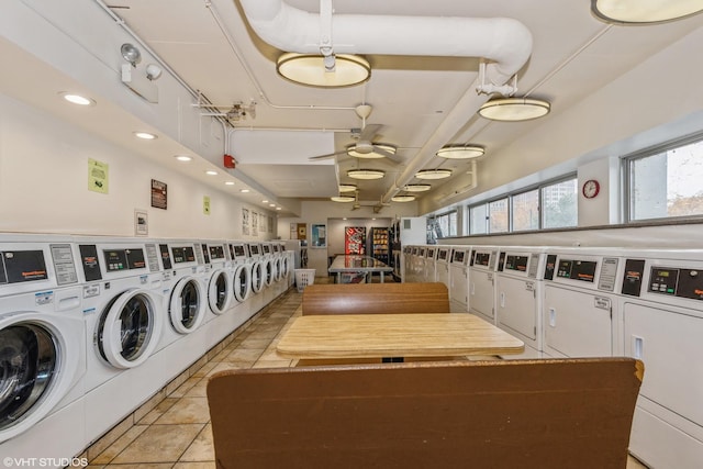 washroom with washer and dryer, ceiling fan, and light tile patterned floors