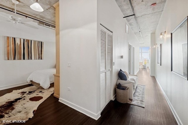 corridor with dark hardwood / wood-style floors