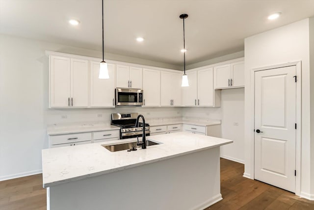 kitchen featuring white cabinetry, an island with sink, and appliances with stainless steel finishes